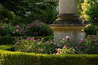 A rose garden surrounding an obelisk at Chiswick House Gardens, Chiswick, London, UK