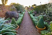 The Long Walk at Wollerton Old Hall Garden, Shropshire - Planting includes: Buddleja 'Charming' and Astelia 'Silver Shadow' 