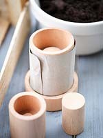 Making paper pots using brown paper