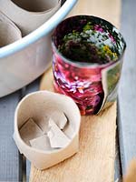 Homemade paper pots using toilet roll and colourful magazine