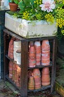Vintage terracotta plant pots stored