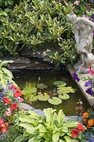 Small garden pond with statue