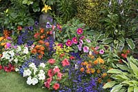 Colourful flower border in small garden
