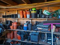 Plastic plant pots in a potting shed 