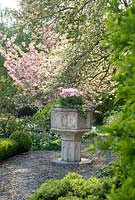 Stone urn in Cotswold Manor House Garden 