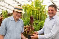 Portrait of Roy Cheek on the left with Matt Soper owner of Hampshire Carnivorous Plants with a new variety of Sarracenia x soperi 'Roy Cheek' Pitcher Plant at RHS Hampton court flower show July 2018