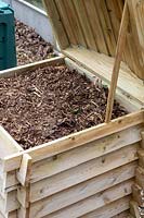 Wooden compost bin with hinge lid