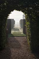 Hornbeam Arch and Ornate Gate - East Ruston Old Vicarage Gardens, Norfolk, UK. 