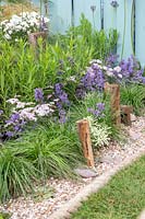 Seaside gravel garden with painted timber fence. By The Sea, RHS Hampton Court Palace Flower Show, 2017. Design: James Callicott, Sponsors: Southend.
