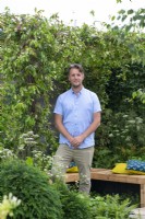 Designer Mark Long in the garden he designed for Hampton Court Flower Festival 2021. A Place to Meet Again.