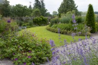 The Upper Walled Garden, flower border with grass path - Designer: Penelope Hobhouse - June