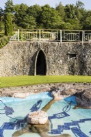 View over pool to entrance to the Grotto. July