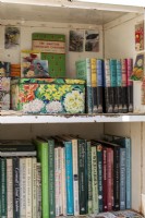 Bookcase filled with gardening books and paraphernalia