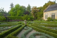 Parterre with beds edged with Buxus - Box - filled with Santolina chamaecyparissus set off with gravel