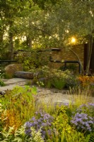 Sunrise over autumnal plantings in the M  and  G Garden, a shared urban space designed by Charlotte Harris and Hugo Bugg.
