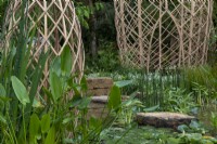 Guangzhou Garden with bamboo structures with water in between.  Plants include:  Equisetum hyemale, Menyanthes trifoliata, Pontederia cordata and Nymphaeaceae sp. 