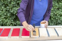 Painting the reverse face of the planks bright colours