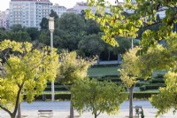 View through trees across park.  Lisbon, Portugal, September. 
