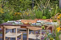 Outdoor dining area. The Parsley Box Garden at Chelsea Flower Show 2021 