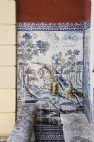 Glazed tiles or Azuljelos on wall of house depicting a knight on a horse. Lisbon, Portugal, September.