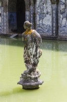Sculpture of woman in the Basin of the Knights pool . Lisbon, Portugal, September.