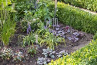 Newly planted perennial border with tools
