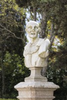 Bust on plinth in the Pensile Garden. Queluz, Lisbon, Portugal, September. 