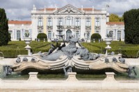  Ornate fountain in raised pond showing sculpture, beyond parterre and palace. Queluz, Lisbon, Portugal, September. 