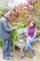 Two women talking in the garden