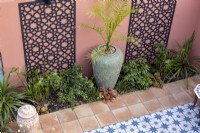 Aerial view of Moroccan style patio with decorative screens in suburban garden