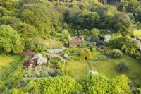 View over whole garden with house in the centre; image taken with drone. July. Summer.