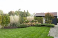 Lawn with mixed planted border.