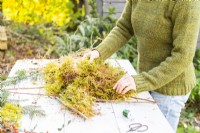 Woman placing moss on the star