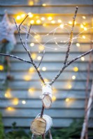 Large birch reindeer with fairy lights on its antlers