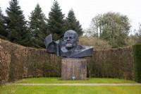 A bronze bust of Lenin from Latvia in the Sculpture Garden at Thenford Gardens and Arboretum, Thenford, Burford, Oxfordshire, UK