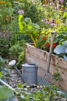 Organic garden with raised beds and garden tools.