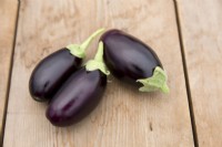 Aubergine 'Pot Black' on a wooden table
