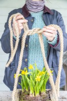Woman tying the ends of the rope together