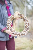 Woman holding the homemade pussy willow wreath