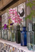 Victorian glass bottles used as display vases
