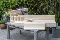 Step-by-Step Making a Potting Bench. Step 1: ensure timber is cut to correct lengths for top and bottom shelves, sides, supports and legs.