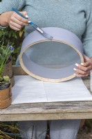 Step-by-Step Planting Wooden Flour Sieves with Spring Flowers. Step 1: using an outdoor paint, apply several coats to the bentwood flour sieve.