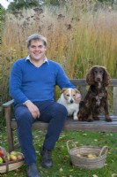 Alasdair Cameron, landscape designer, with the family terrier, Scoot, and spaniel, Teasel
