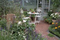 ''Nature's Resilience' at BBC Gardener's World Live 2021 - seating area amongst pastel themed perennials