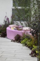 'The Lillian Prime Trust Garden' - BBC Gardener's World Live 2021 - pink semi circular stone seating area 