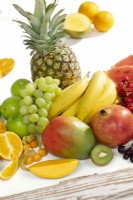 Fruit mix with pineapple, mango, grapes, banana and pomegranate, summer, June