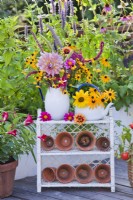 Summer flower arrangement on stand.