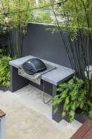 Inbuilt barbecue with bespoke cast concrete bench top.
