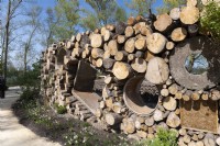 Almere The Netherlands 19th April 2022
Floriade Expo 2022. A ten-yearly botanical garden festival and exhibition, this year taking place in Almere, Flevoland. 
Wall made of materials left from the construction industry and logs from fallen trees 