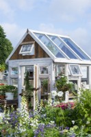 Recycled wooden greenhouse.  Down Memory Lane, RHS Hampton Court Palace Garden Festival 2021